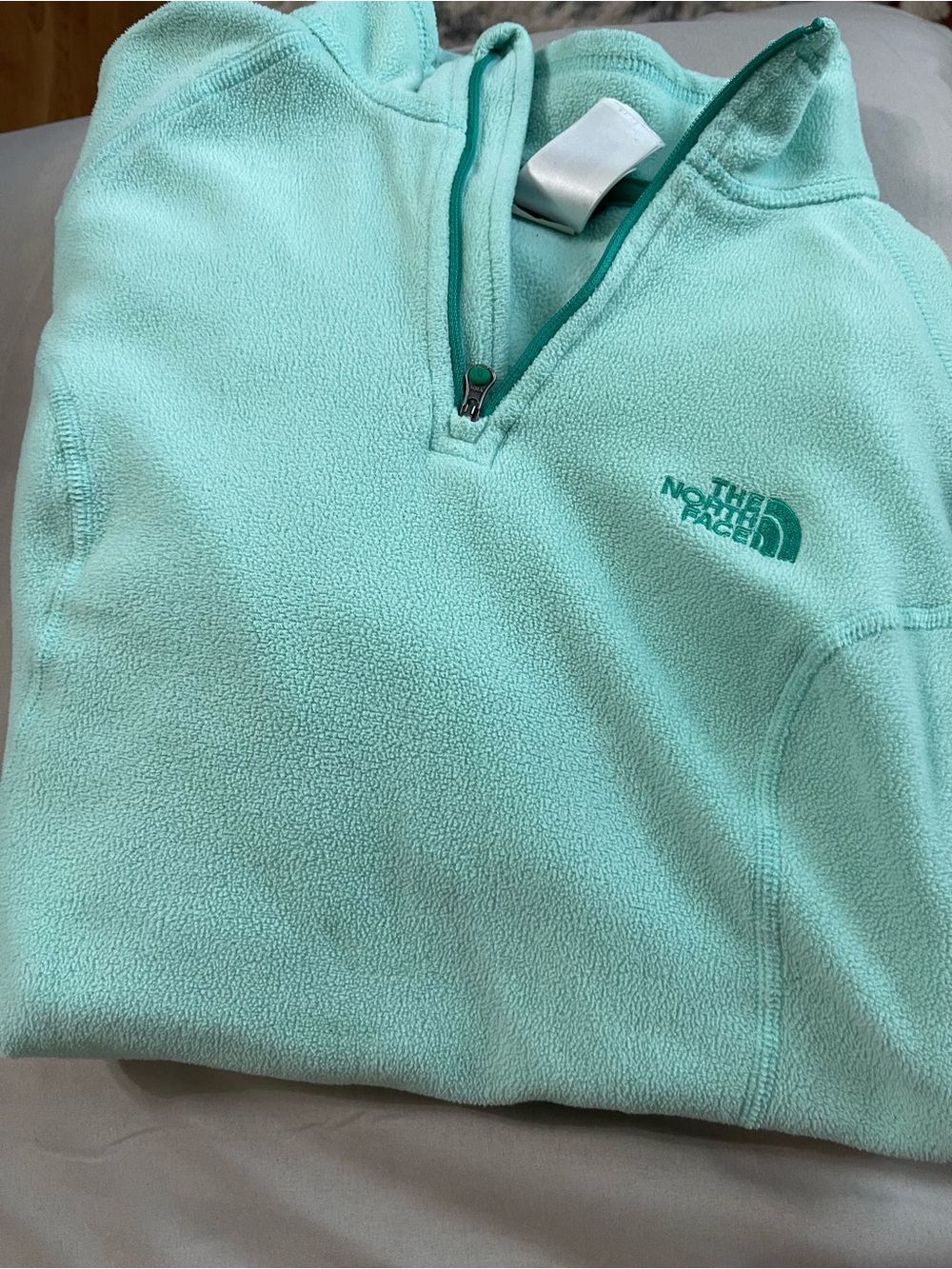 The North Face women’s Mint Green Half-Zip Fleece Pullover